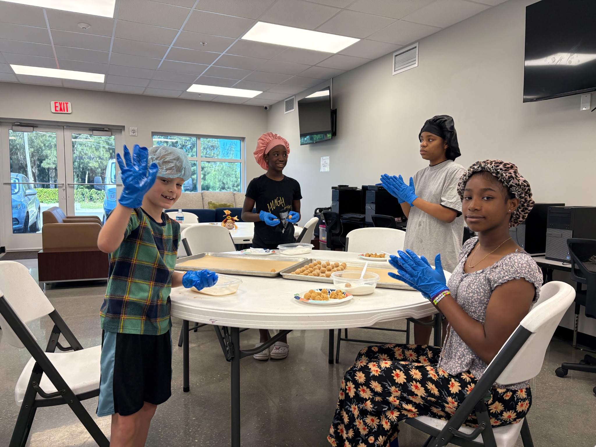Children participating in a life skills cooking activity at Helen’s House Women and Children’s Center in Melbourne Florida