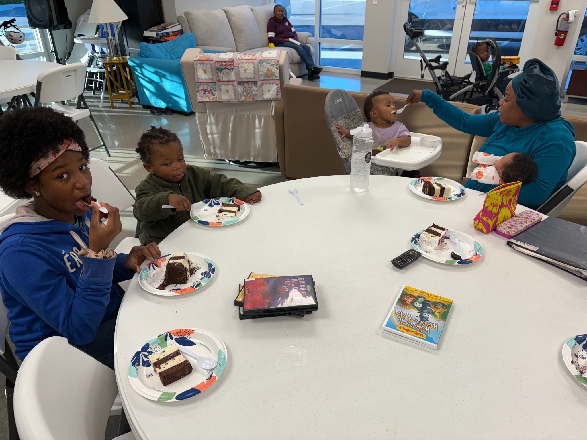 Mother feeding her child during a family gathering at Helen’s House Women and Children’s Center in Melbourne Florida