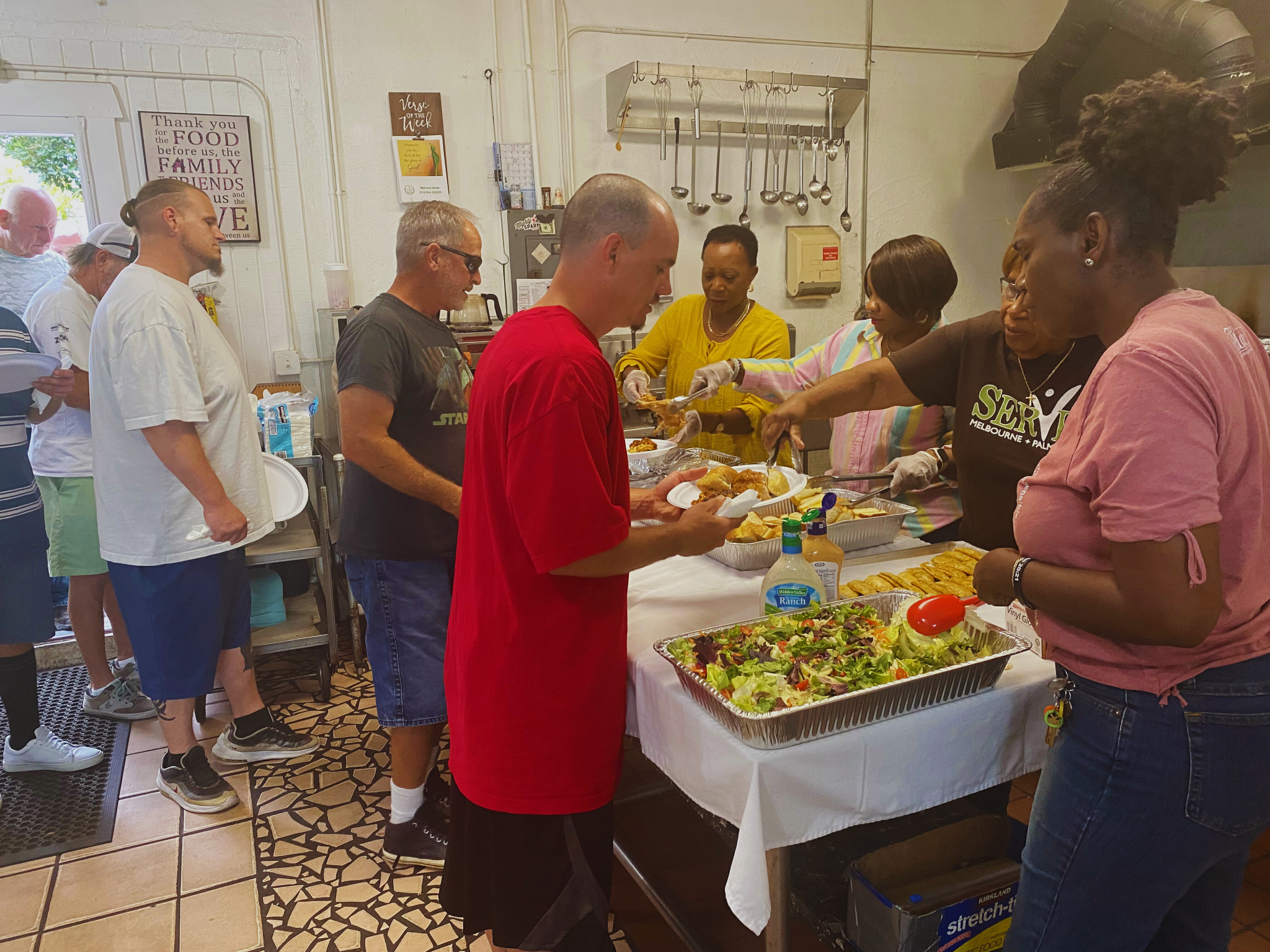 Volunteers serving meals to guests at CITA Rescue Mission in Melbourne, Florida supporting individuals and families across Brevard County