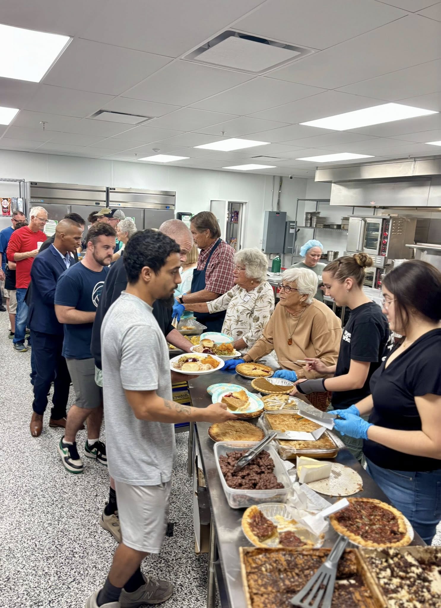 Volunteers serving meals to guests at CITA Rescue Mission in Melbourne Florida