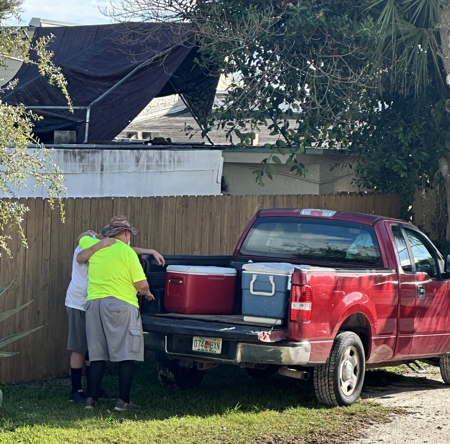 Dave Soldivieri praying with a resident at Christ Is The Answer Rescue Mission