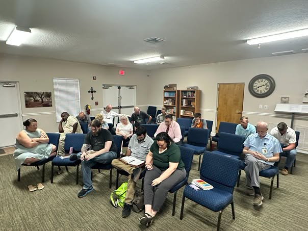 Christ Is The Answer Rescue Mission staff praying together